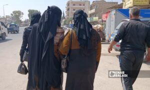 Young women go shopping in one of Idlib markets - September 2022 (Enab Baladi / Huda al-Kulaib)