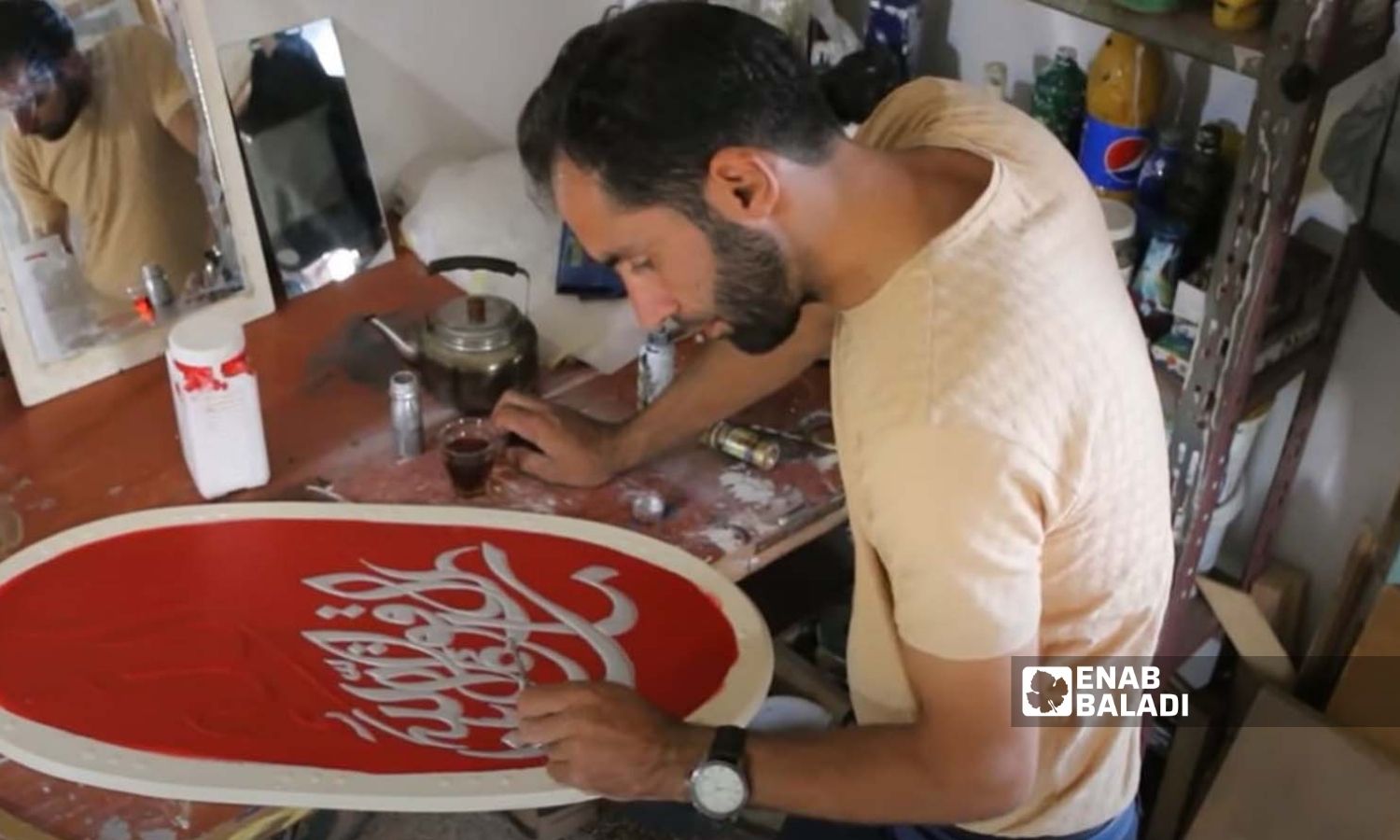 A young man practicing Persian embellishment painting (Ajami art) in Idlib - 26 August 2022 (Enab Baladi/Anas al-Khouli)