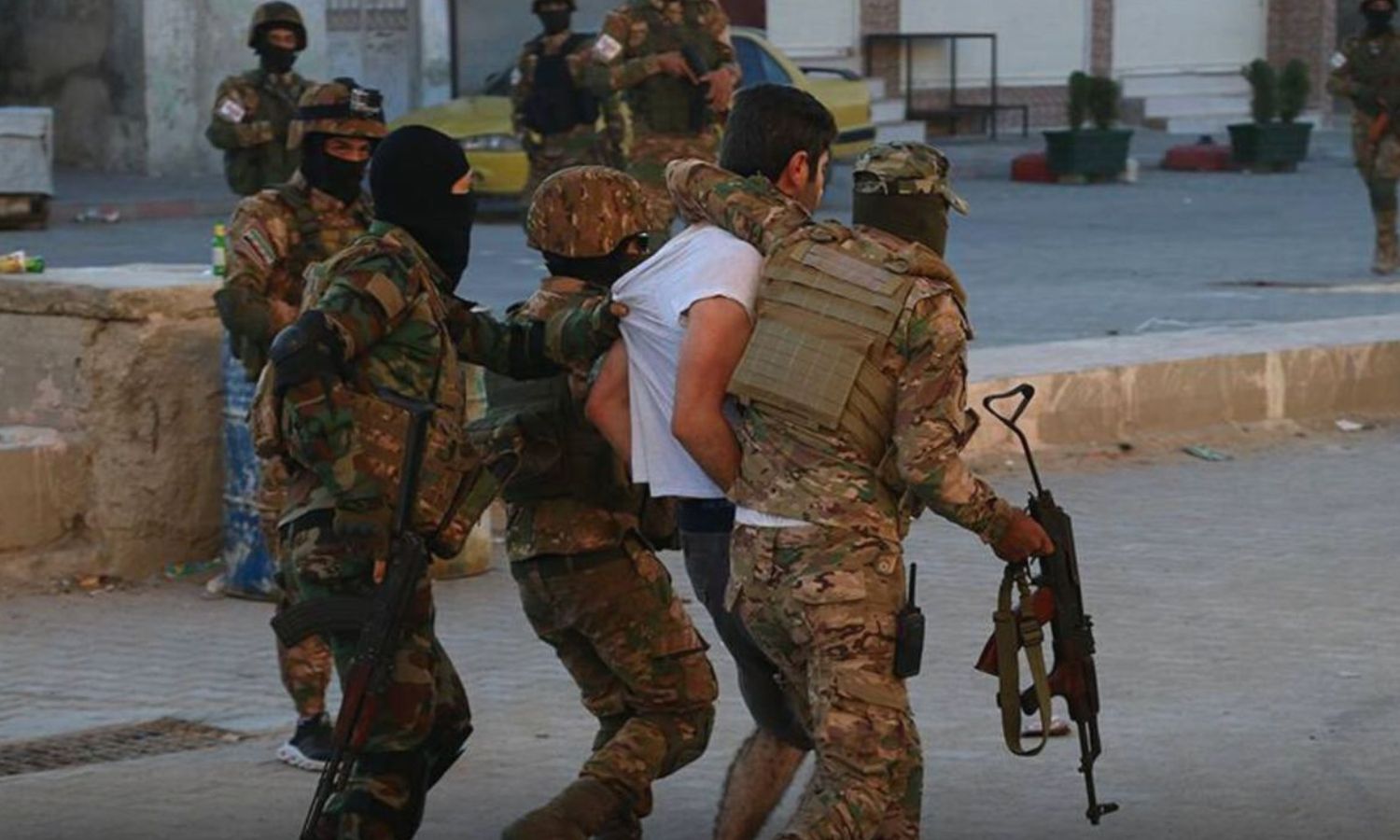 Members of the Syrian National Army (SNA) arresting a wanted person during a security campaign - 15 July 2021 (Azm / Twitter)