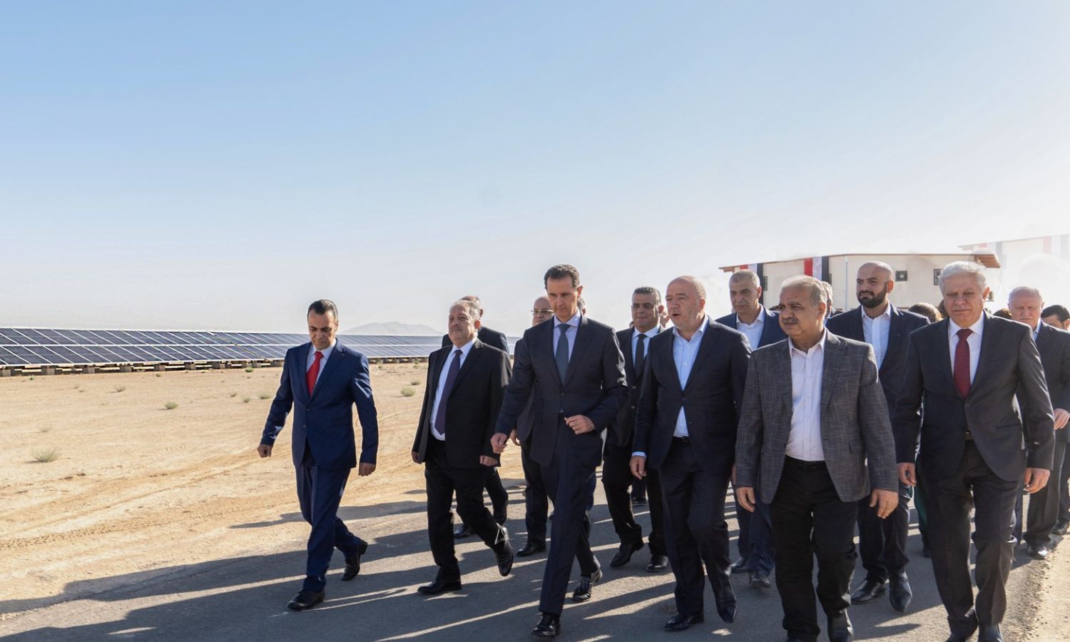 The head of the Syrian regime Bashar al-Assad accompanied by businessman Badih Aldroubi during the launch of the photovoltaic energy project in the industrial city of Adra in Damascus countryside - September 2022 (Presidency of the Republic account on Facebook)