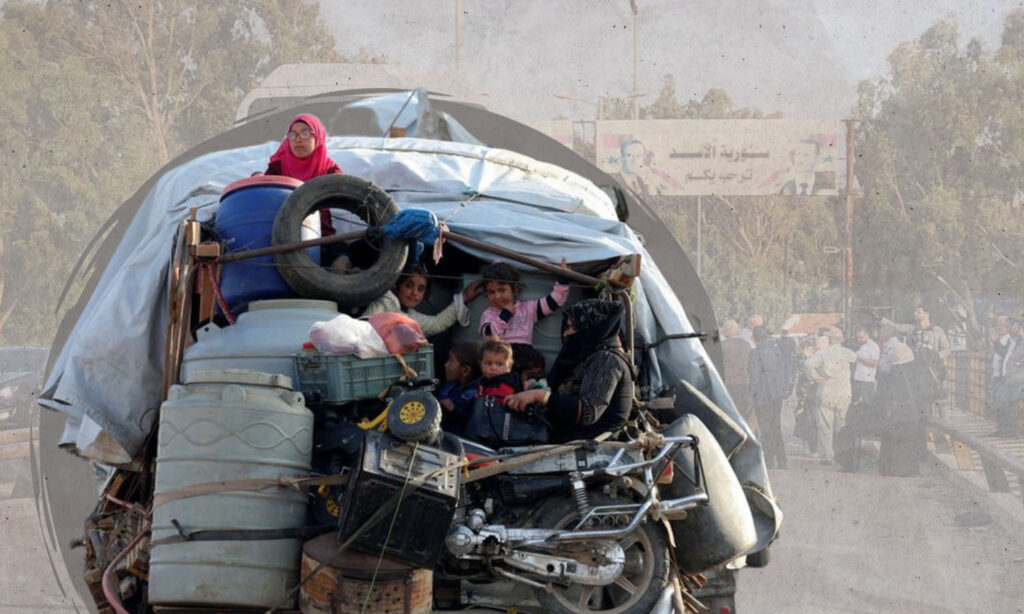 Syrian refugees sit with their belongings on a pick-up truck as they prepare to return to Syria from Wadi Hmayyed, on the outskirts of the Lebanese border town of Arsal - 26 October 2022 (Reuters)