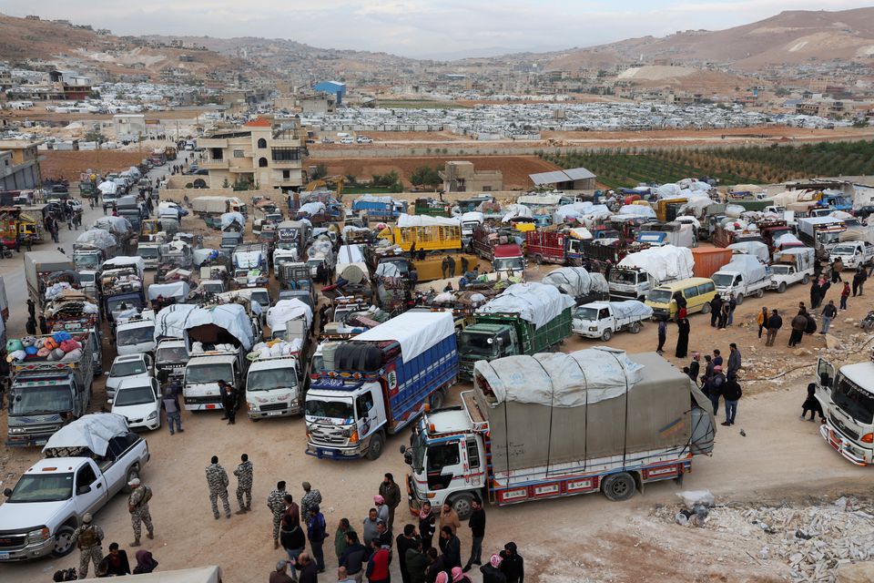 Syrian refugees with their belongings as they prepare to return to Syria from Wadi Hmayyed, on the outskirts of the Lebanese border town of Arsal - 26 October 2022 (Reuters)