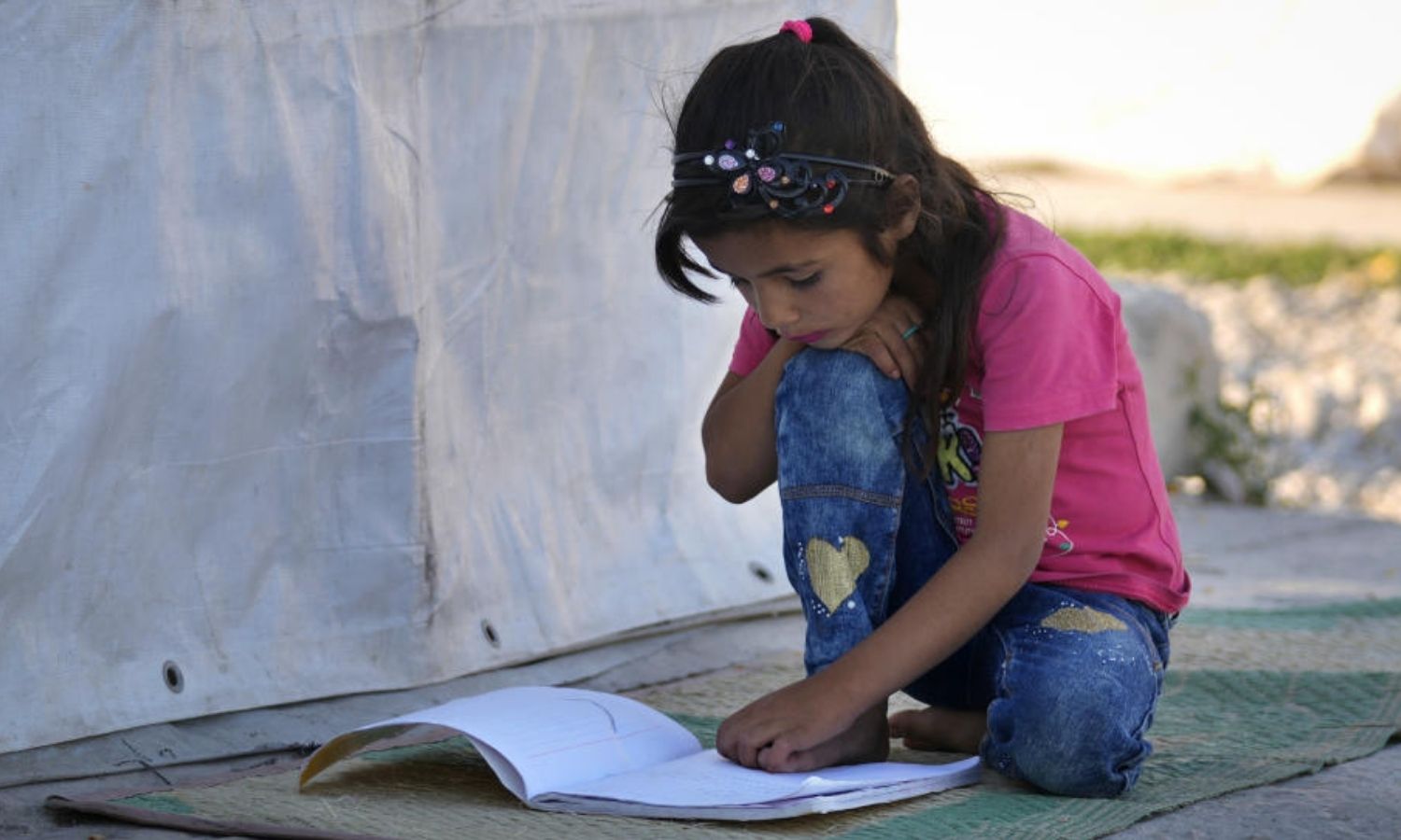 A refugee Syrian child studying in a camp in the Lebanese al-Bekaa Valley - 7 July 2022 (AP)