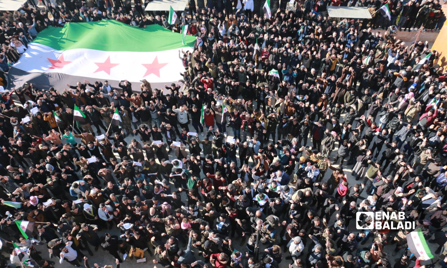 People of border Azaz city in the northern countryside of Aleppo went to the streets on Friday denouncing the Turkish statements about rapprochement with the Syrian regime, affirming the continuation of the Syrian revolution - 30 December 2022 (Enab Baladi/Dayan Junpaz)
