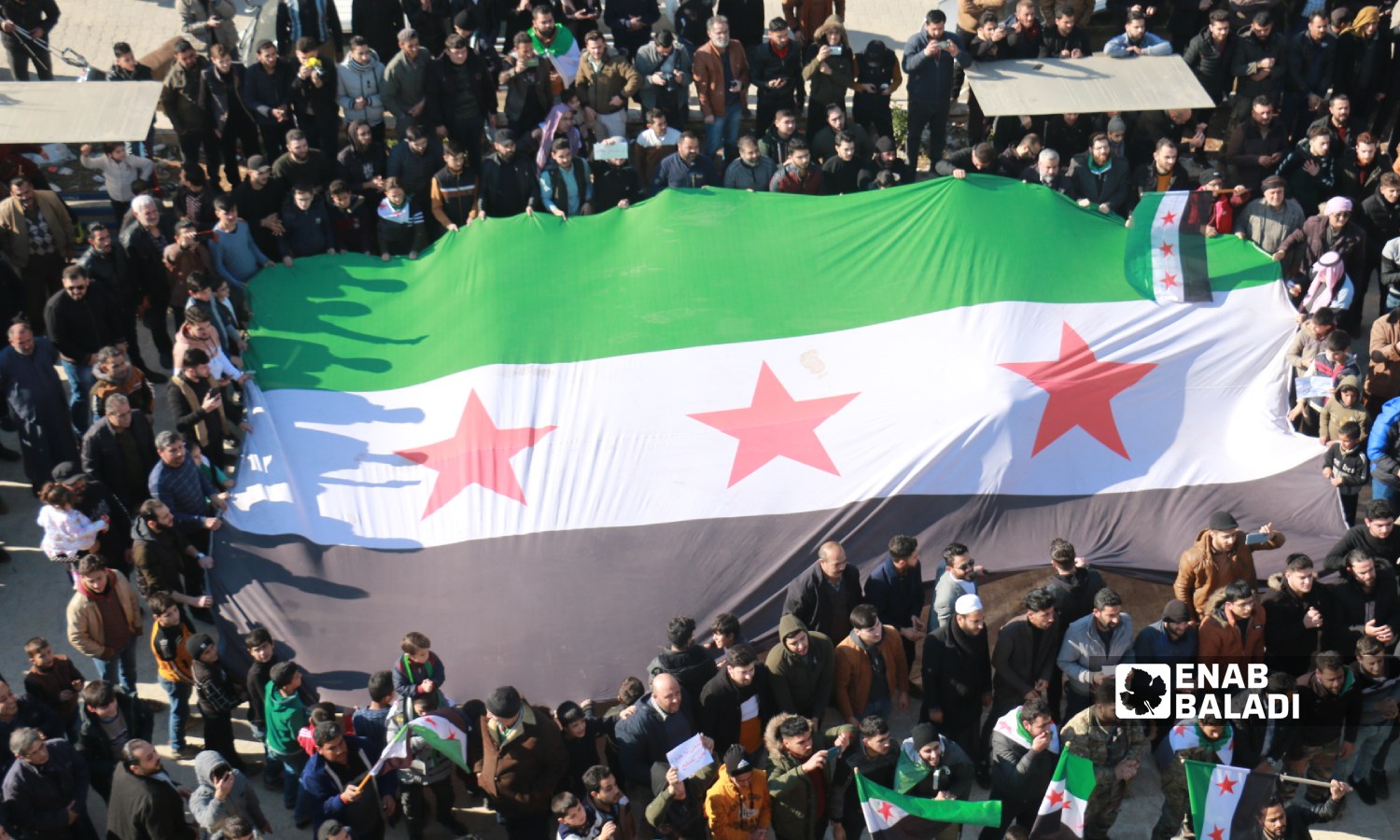 People of border Azaz city in the northern countryside of Aleppo went to the streets on Friday denouncing the Turkish statements about rapprochement with the Syrian regime, affirming the continuation of the Syrian revolution - 30 December 2022 (Enab Baladi/Dayan Junpaz)