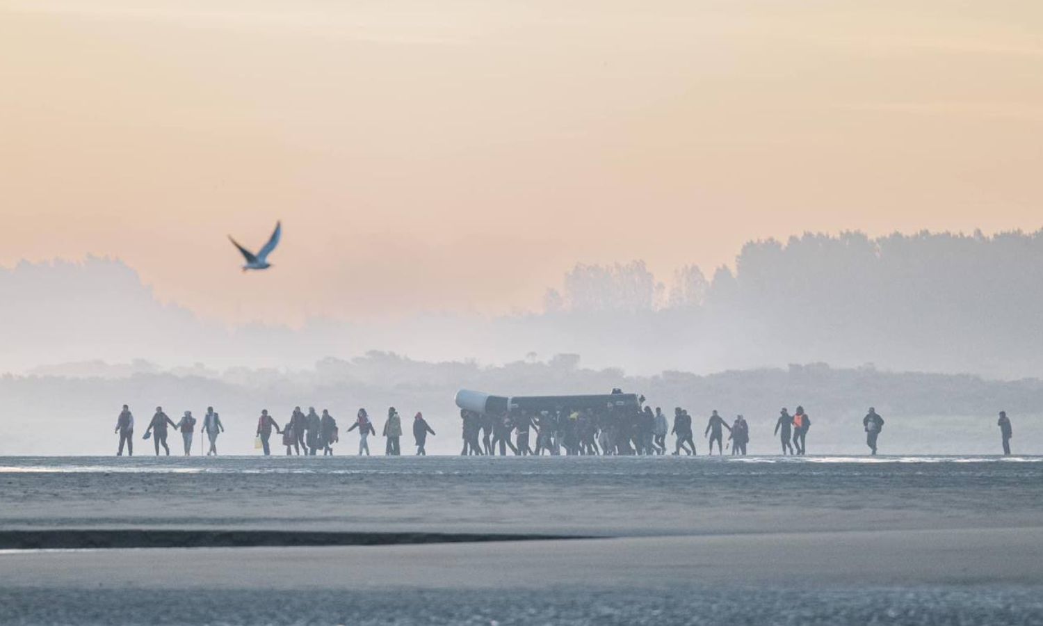 Refugees preparing to try to cross the English Channel from the French coast towards Britain - 13 October 2022 (AFP)