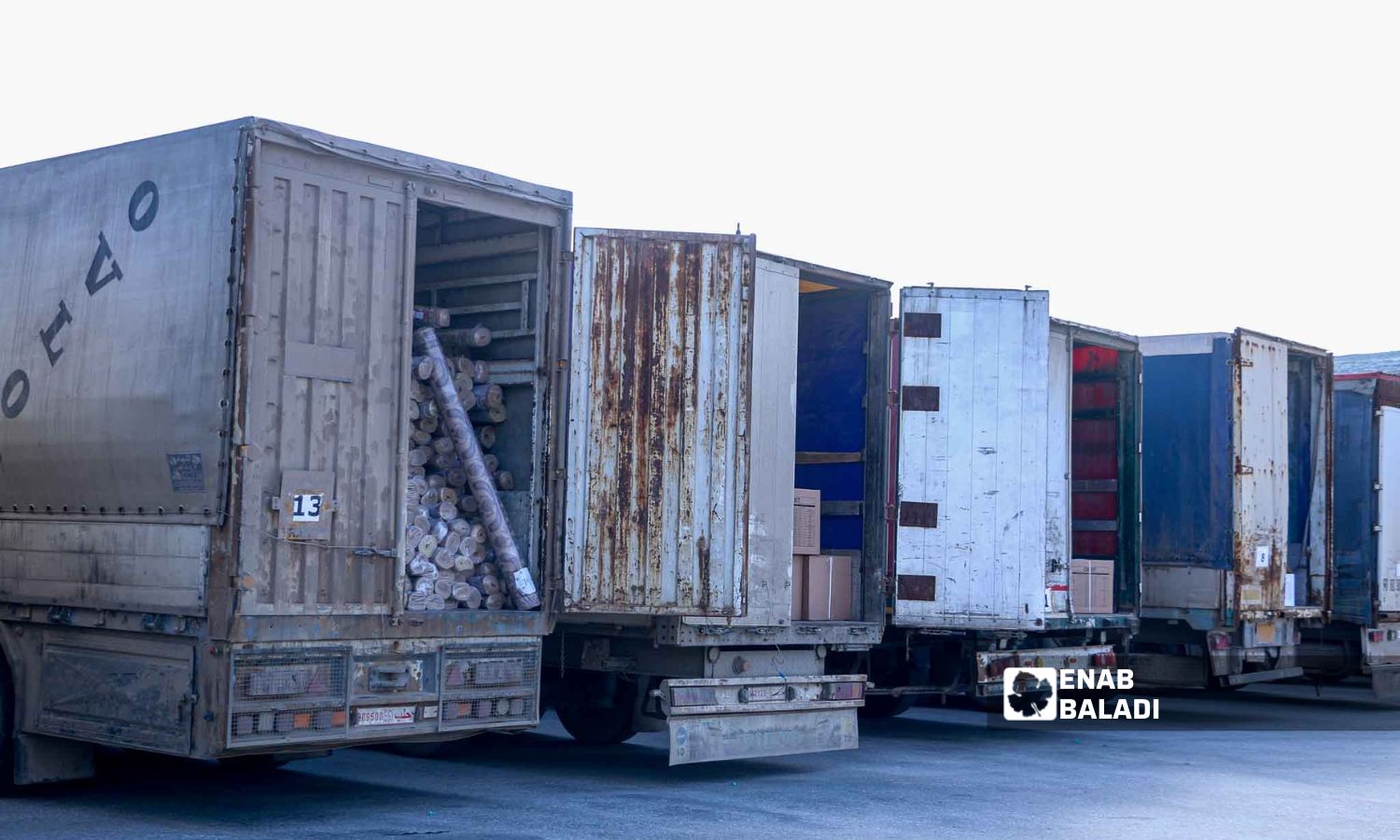 Trucks loaded with UN aid at the Bab al-Hawa crossing in Idlib - February 10, 2023 (Enab Baladi/Mohammad Nasan Dabel)