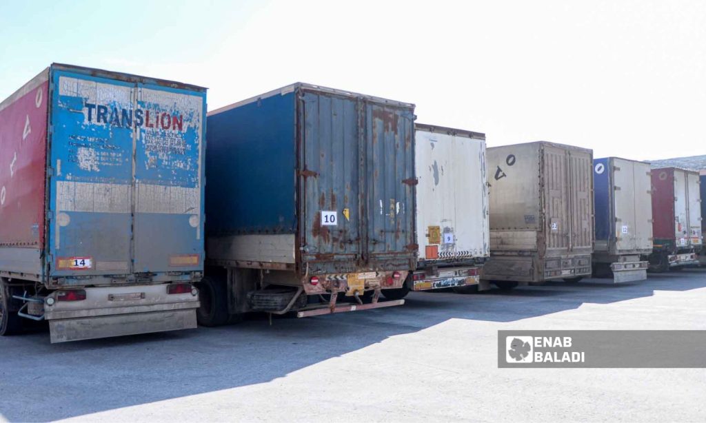 Trucks loaded with UN aid at Bab al-Hawa border crossing in Idlib - February 10, 2023 (Enab Baladi/Mohammad Nasan Dabel)