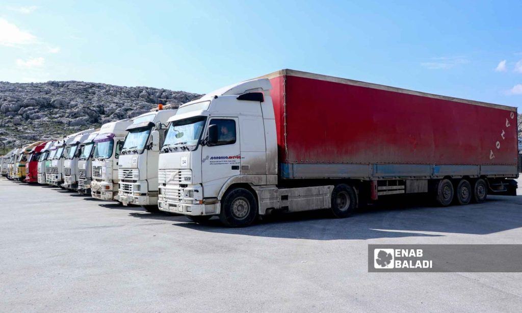 Trucks loaded with UN aid at Bab al-Hawa border crossing in Idlib - February 10, 2023 (Enab Baladi/Mohammad Nasan Dabel)