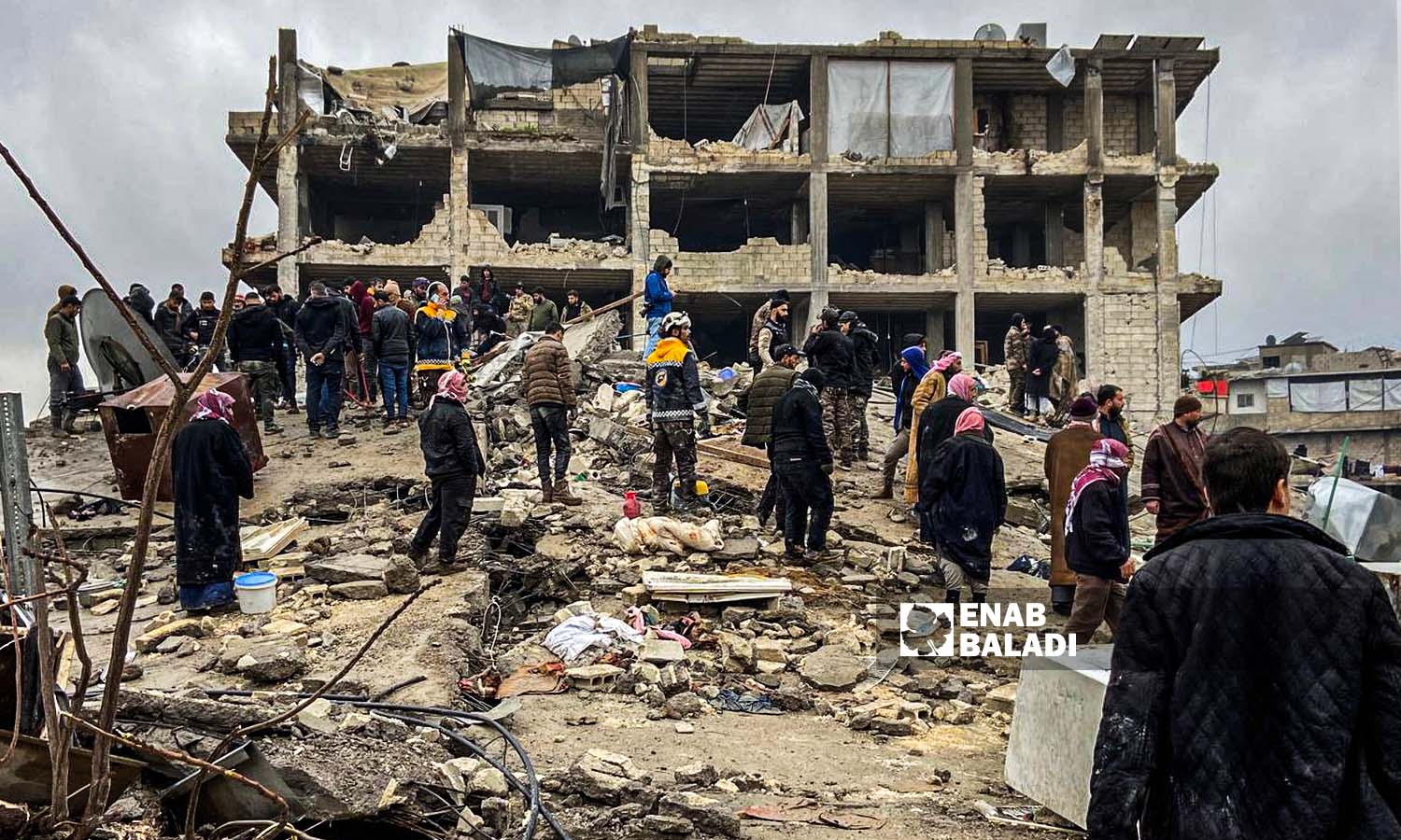 Syria Civil Defense workers and volunteer residents try to rescue and remove the victims who were trapped under the rubble in the Jindires area in the countryside of Afrin city, following an earthquake that struck northwestern Syria - February 6, 2023 (Enab Baladi/Amir Kharboutli)