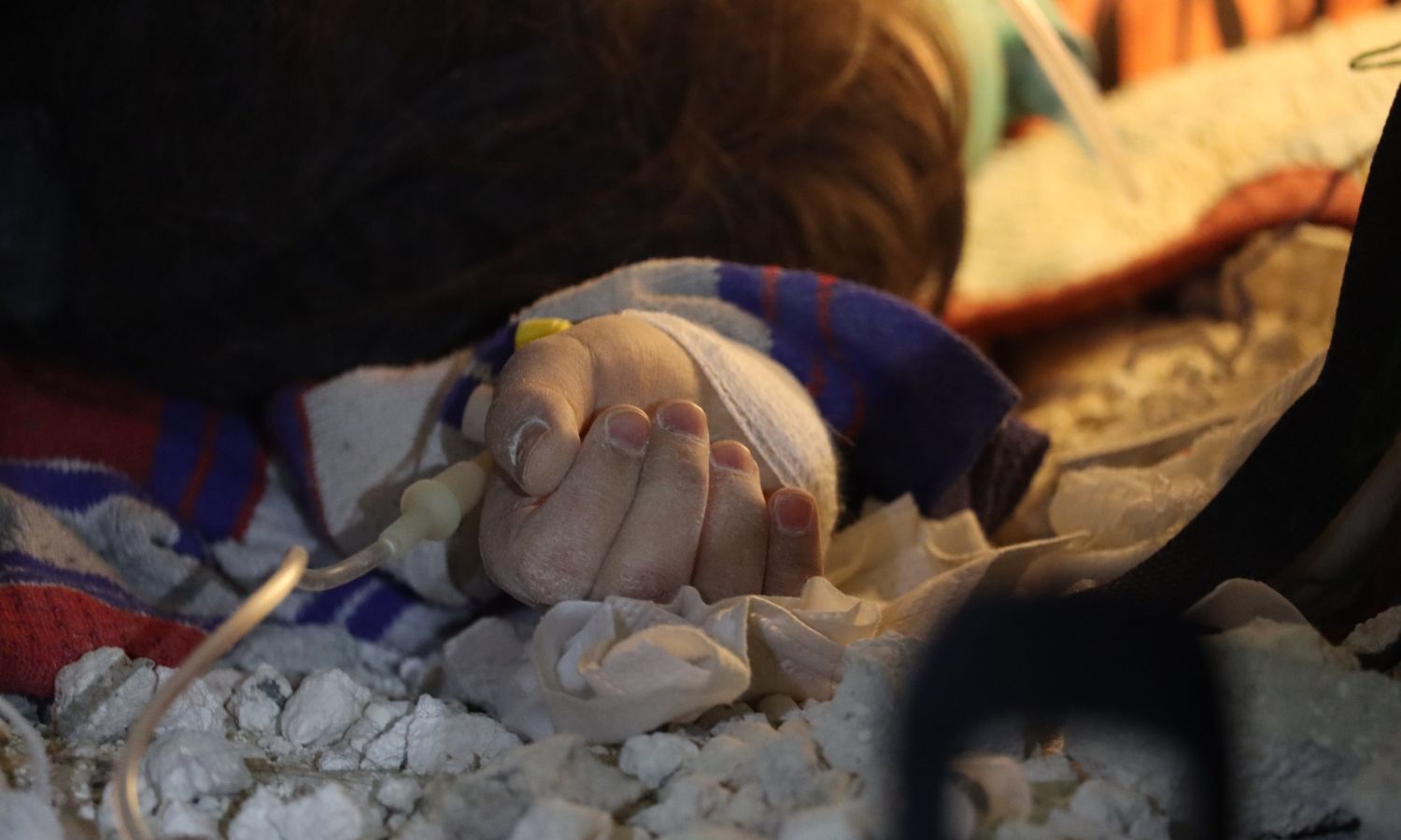 Sham's little hand, who was trapped under the rubble in Armanaz town in Idlib countryside before being rescued by the Syria Civil Defense - February 7, 2023 (Facebook/Civil Defense) 