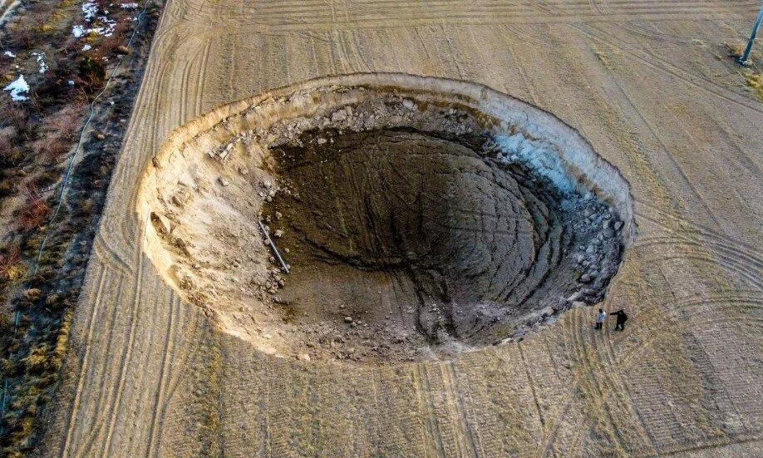 An aerial view of a sinkhole in Karapınar district in southern Konya state with a diameter of 37 meters and a depth of 12 meters - February 25, 2023 (Anadolu Agency)