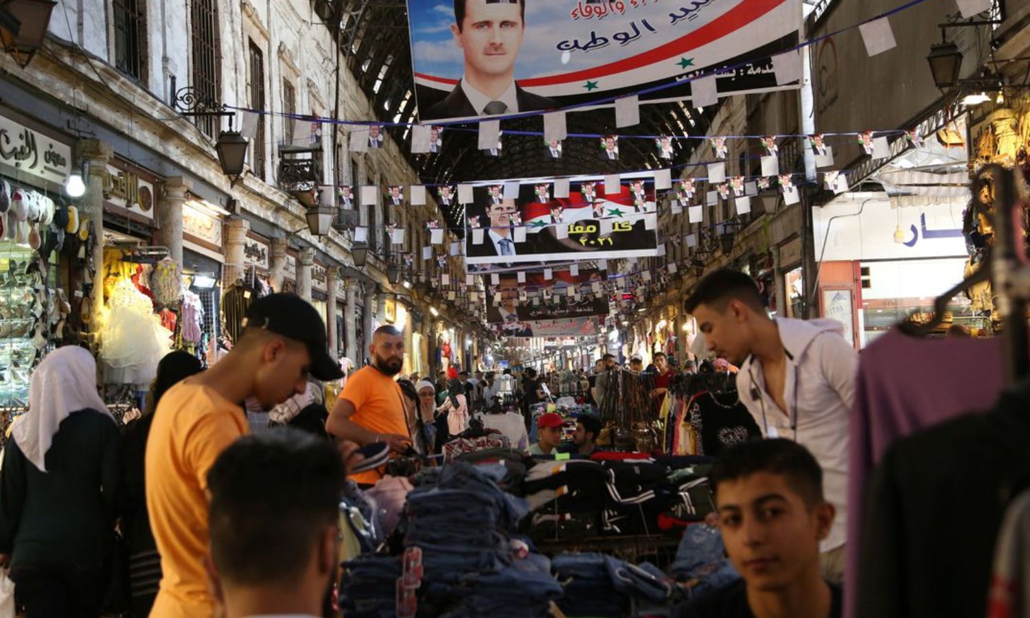 The traditional al-Hamidiya market with posters of the head of the Syrian regime, Bashar al-Assad in Damascus - 22 May 2021 (Reuters)