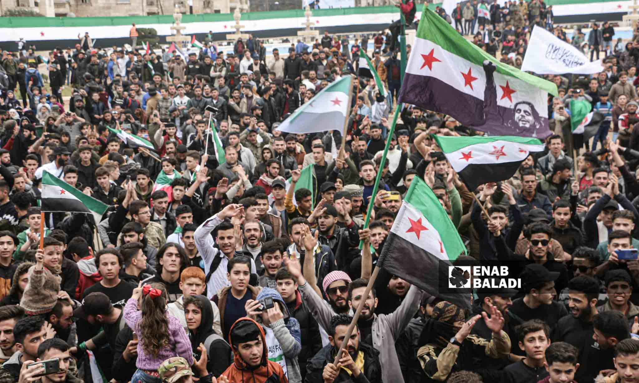 A demonstration in Idlib city to commemorate the 12th anniversary of the Syrian revolution - March 15, 2023 (Enab Baladi/Anas al-Khouli)