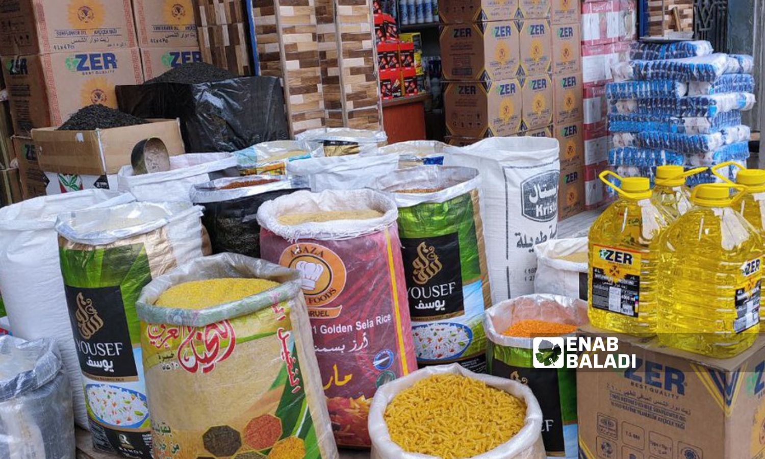 Foodstuffs displayed in front of a supermarket in the northeastern city of Qamishli - March 22, 2023 (Enab Baladi/Majd al-Salem)