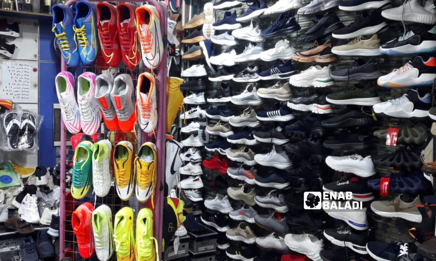 Used sports shoes in a store in the northwestern city of Idlib - May 20, 2023 (Enab Baladi/Anas al-Khouli)