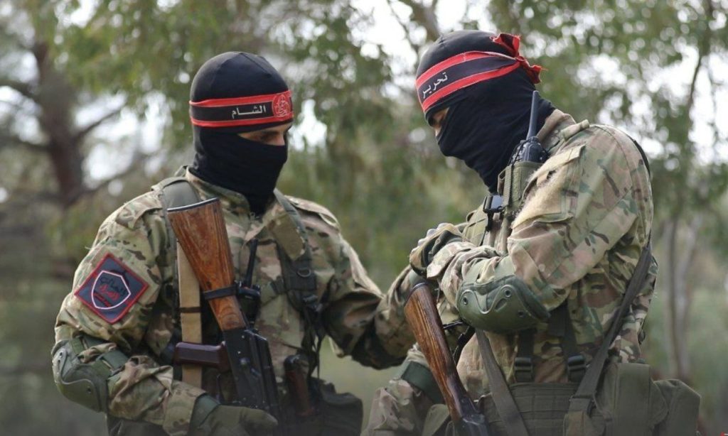 Two Tahrir al-Sham fighters operating in the Red Bands Brigades prior to the “Inghimasi” operation in the countryside of Latakia, northwestern Syria - February 26, 2023 (Amjad Agency)