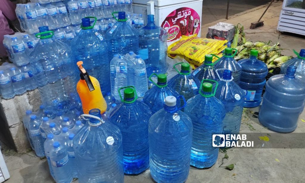 Some people in northwestern Syria depend on mineral water to avoid calcareous water damage - June 29, 2023 (Enab Baladi/Abdul Karim al-Thalji)