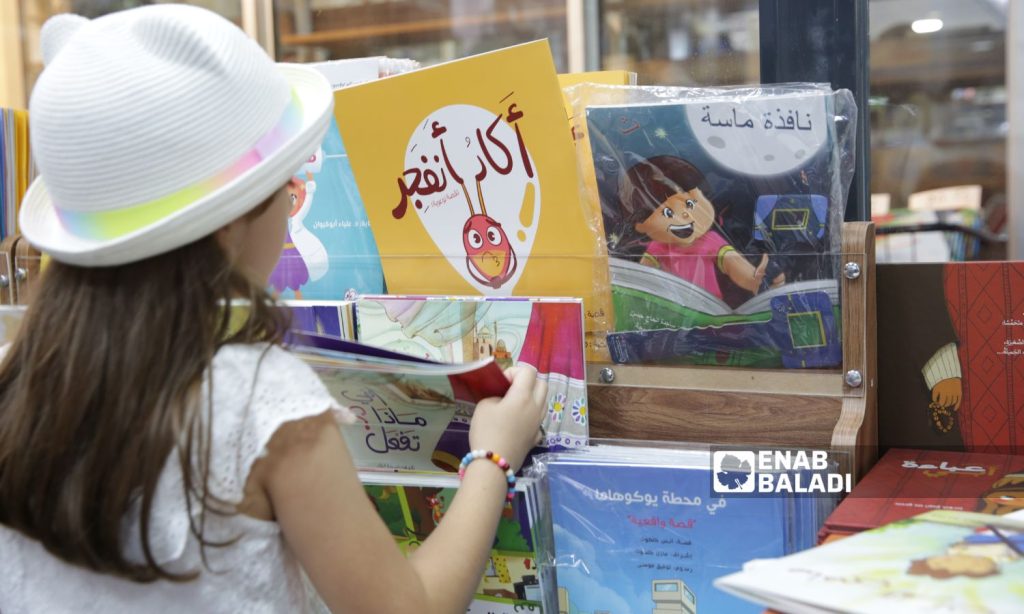 A Syrian child attends an Arabic language workshop at Roya publishing house in Istanbul, Turkey - August 5, 2022 (Enab Baladi)