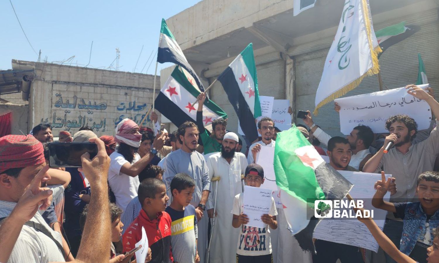 In solidarity with As-Suwayda people and other Syrian governorates, protesters in al-Jarthi al-Sharqi town in Deir Ezzor’s eastern countryside call for the overthrow of the Syrian regime, reaffirming the principles of the Syrian revolution - August 25, 2023 (Enab Baladi/Obadah al-Sheikh)
