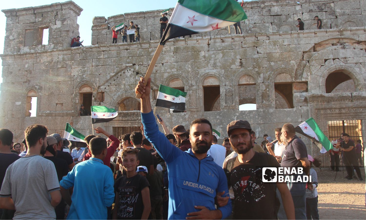 In solidarity with As-Suwayda people and other Syrian governorates, protesters in Jabal al-Soummaq village gather near Qalb Loze church in Idlib countryside to call for the overthrow of the Syrian regime, reaffirming the principles of the Syrian revolution - August 25, 2023 (Enab Baladi/Iyad Abdul Jawad)
