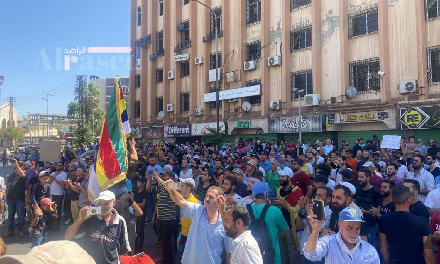 Protesters chanting and calling for the overthrow of the Syrian regime in al-Sayer Square in the city center of As-Suwayda - August 22, 2023 (Facebook/Al-Rased)