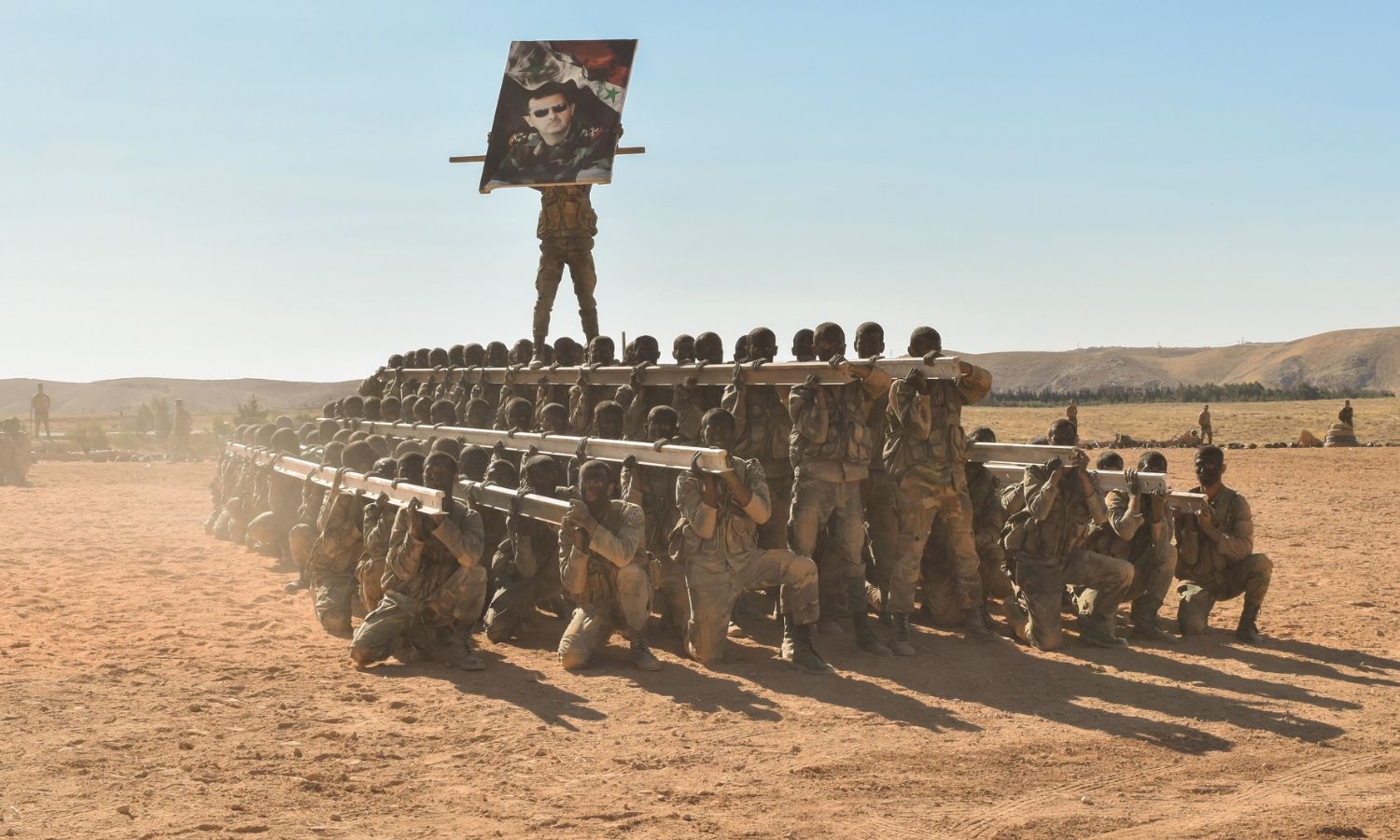 Forces from the Syrian regime army perform military demonstrations during the graduation of the officer cadets - July 15, 2023 (Regime’s Defense Ministry)