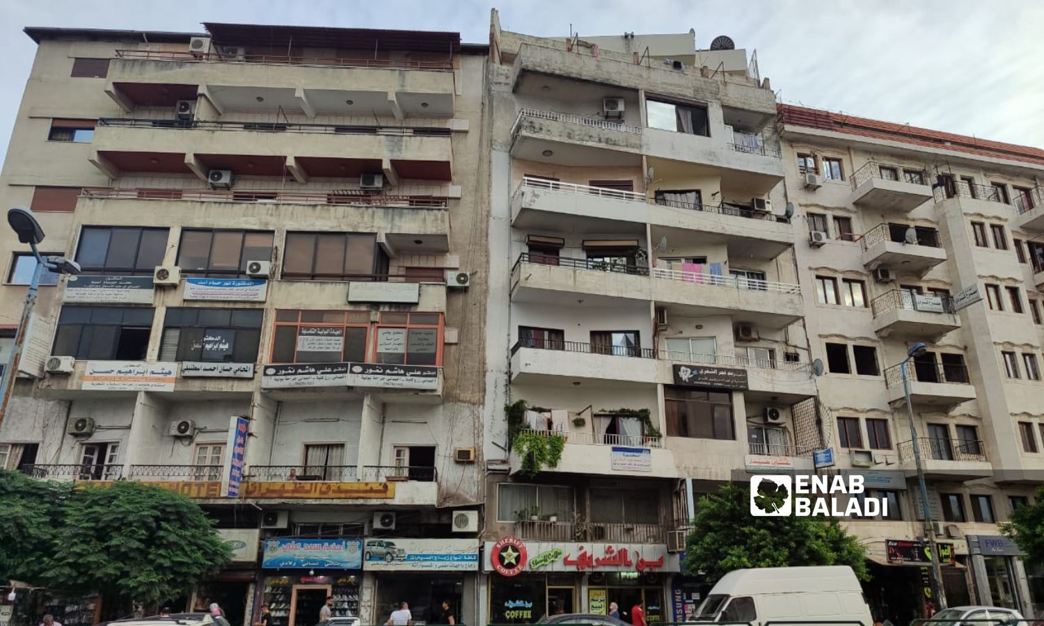 Buildings in Sheikh Daher Square in the coastal city of Latakia - September 12, 2023 (Enab Baladi/Linda Ali)