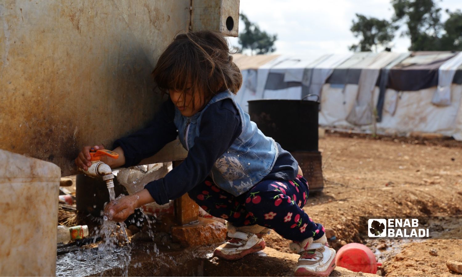 A child girl in one of the camps in the Ziyadiyah area in the center of Afrin city in the northern countryside of Aleppo - January 2022 (Enab Baladi/Amir Kharboutli)