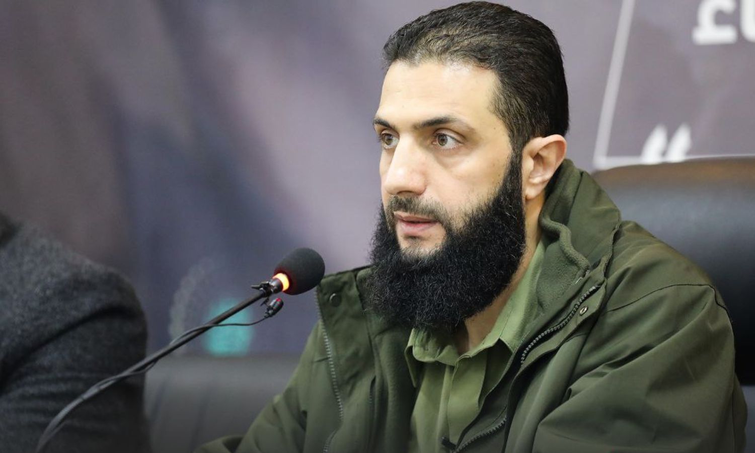 Abu Mohammad al-Jolani, HTS commander, during a conference to launch a support campaign for the camps in northern Syria - December 15, 2022 (Amjad)