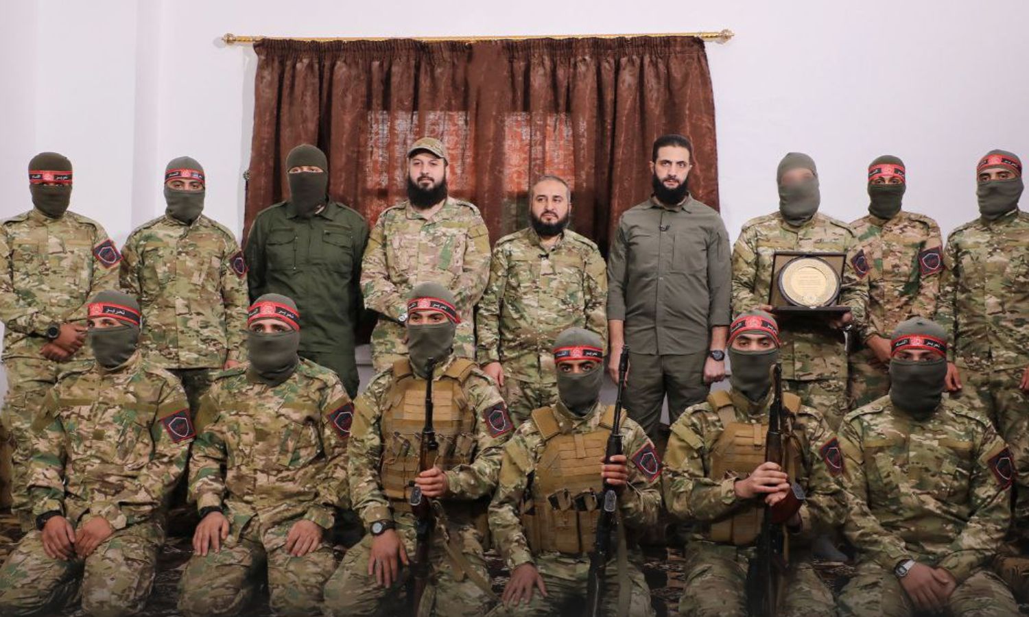 The HTS commander, Abu Mohammad al-Jolani, honoring members of the Red Bands Brigades in Idlib - November 2022 (Amjad)