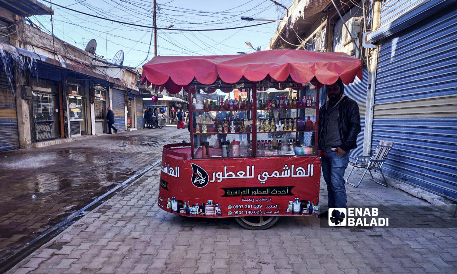 A street vendor selling fragrances in Qamishli city - December 1, 2023 (Enab Baladi/Rita al-Ahmad)
