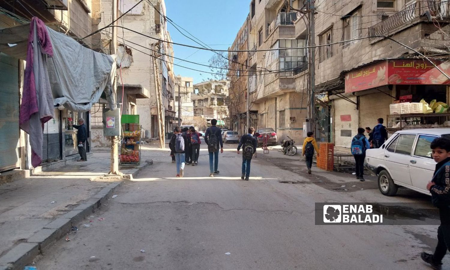 Children heading home after departing from school in Douma city - January 22, 2024 (Enab Baladi/Sarah al-Ahmad)
