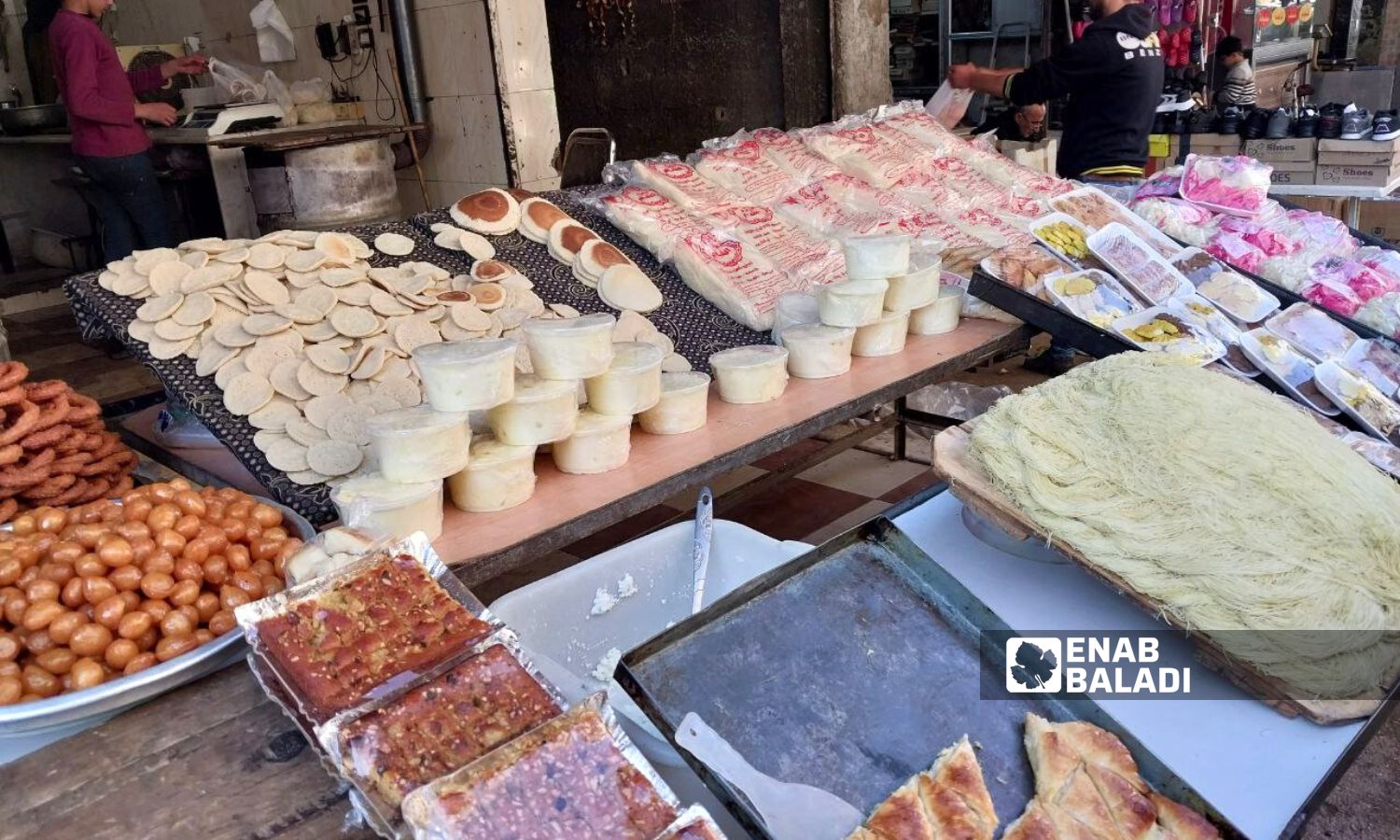 Syrian sweets on display on a stall in Douma city - January 22, 2024 (Enab Baladi/Sarah al-Ahmad)
