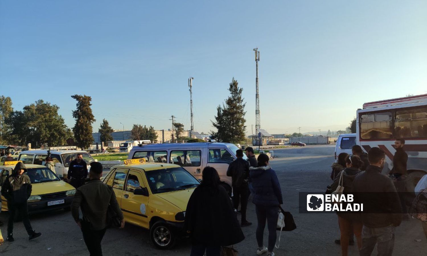 Passengers waiting for buses to take them at the Eastern Latakia Garage - November 29, 2023 (Enab Baladi/Linda Ali)
