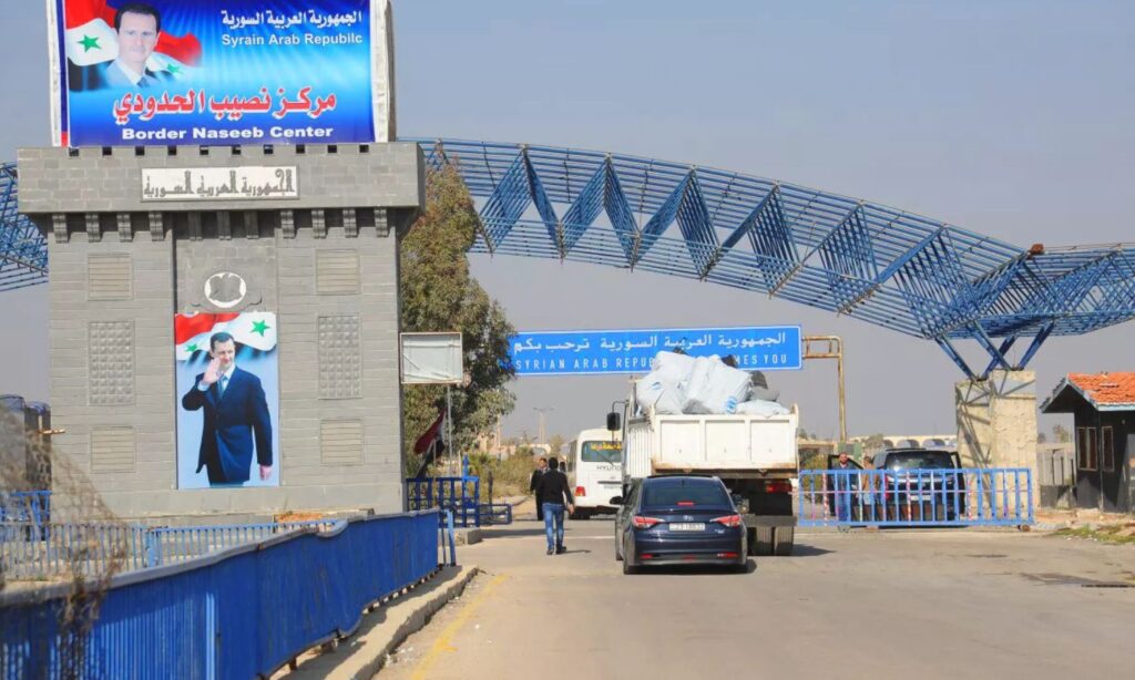 Trucks entering through the Nassib border crossing with Jordan (Sputnik)