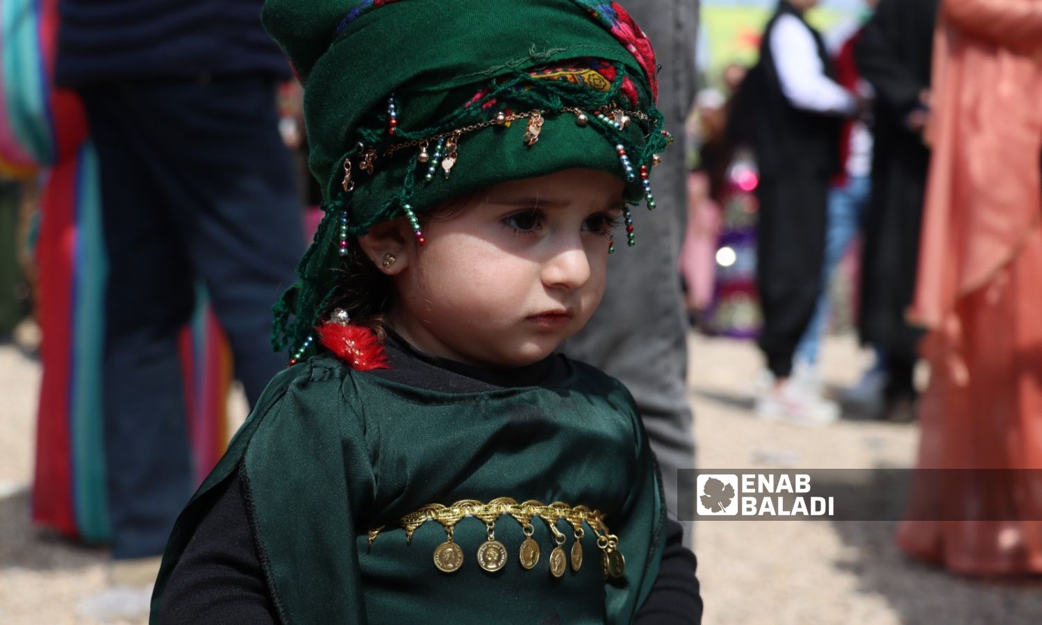 A child in Kurdish clothing during the Nowruz celebrations in the city of Qamishli, northeast Syria - March 21, 2023 (Enab Baladi)