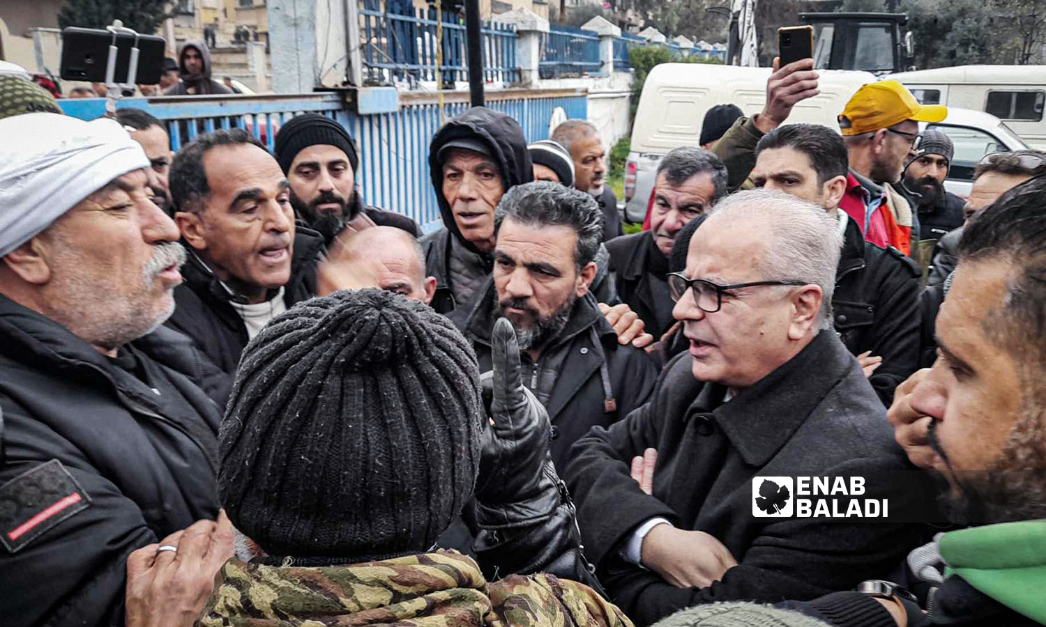 Director of the Water Establishment speaks with protesters in As-Suwayda city, southern Syria - February 19, 2024 (Enab Baladi)
