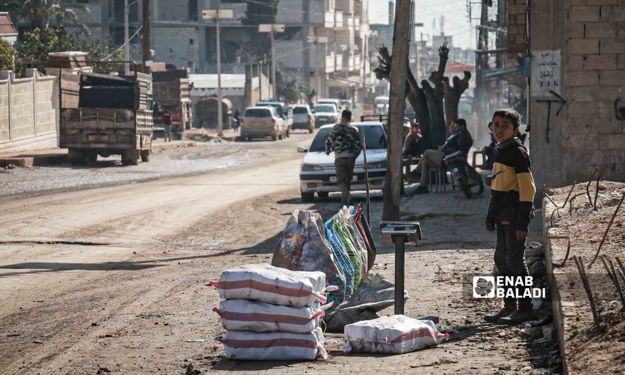 A Syrian child selling goods in a street in Jindires city in northwestern Syria - February 6, 2024 (Enab Baladi/Dayan Junpaz)
