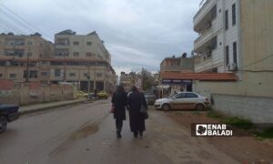 Two women in al-Kashef neighborhood in the city of Daraa, southern Syria - February 17, 2024 (Enab Baladi/Sarah al-Ahmad)