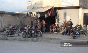 Motorcyclists in Ras al-Ain conducting maintenance on their motorcycles due to problems with sudden stops - February 19, 2024 (Enab Baladi)