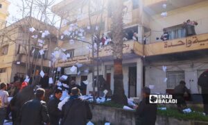 Protesters throw security reports from the al-Ba'ath party branch in the center of As-Suwayda onto the city streets - February 28, 2024 (Enab Baladi)