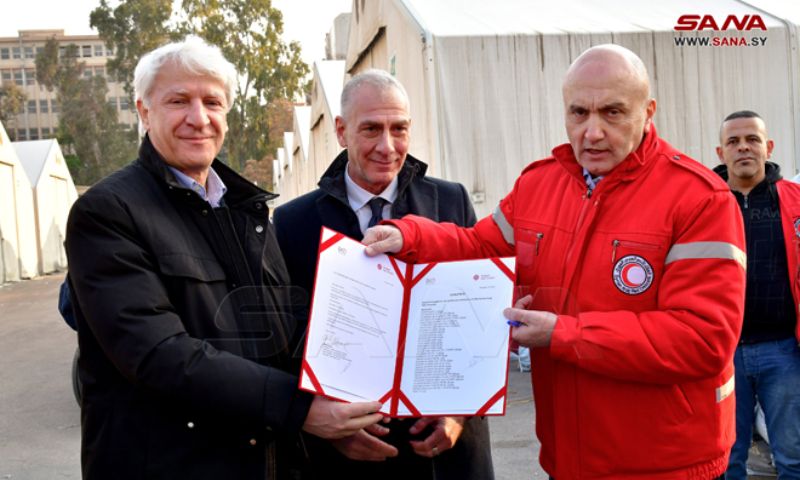 From the ceremony of receiving aid from Italy to Syria, President of the Syrian Arab Red Crescent Khaled Hboubati at Beirut International Airport with the acting Ambassador of Italy in Lebanon, Massimiliano D'Antuono - February 12, 2023 (SANA)