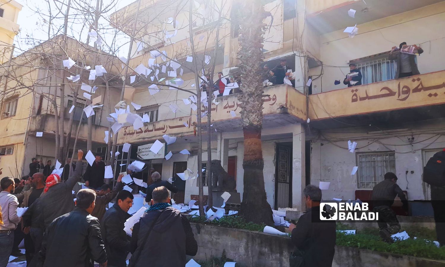 Protesters throw security reports from the Baath party branch in the streets of As-Suwayda - February 28, 2024 (Enab Baladi)