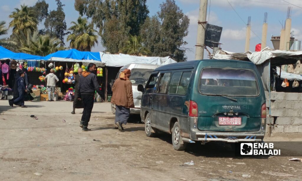 Minibuses in al-Basira city, the eastern countryside of Deir Ezzor – February 22, 2024 (Enab Baladi/Obadah al-Sheikh)