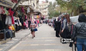 Damascus, al-Qanawat neighborhood shops and stalls selling clothes - February 3, 2024 (Enab Baladi/Sarah al-Ahmad)