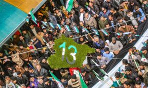 A demonstration to revive the 13th anniversary of the start of the Syrian revolution in the city of Binnish, east of Idlib - March 15, 2024 (Enab Baladi/Iyad Abdul Jawad)