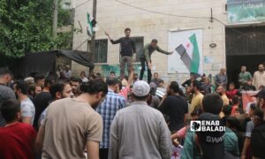 Protesters in Qourqania in the northern countryside of Idlib demand the overthrow of the leader of Hayat Tahrir al-Sham, Abu Mohammad al-Jolani - April 26, 2024 (Enab Baladi/Iyad Abdul Jawad)