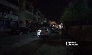 Darkness envelops one of the streets in al-Ramel al-Shemali neighborhood in Latakia - May 4, 2024 (Enab Baladi/Linda Ali)