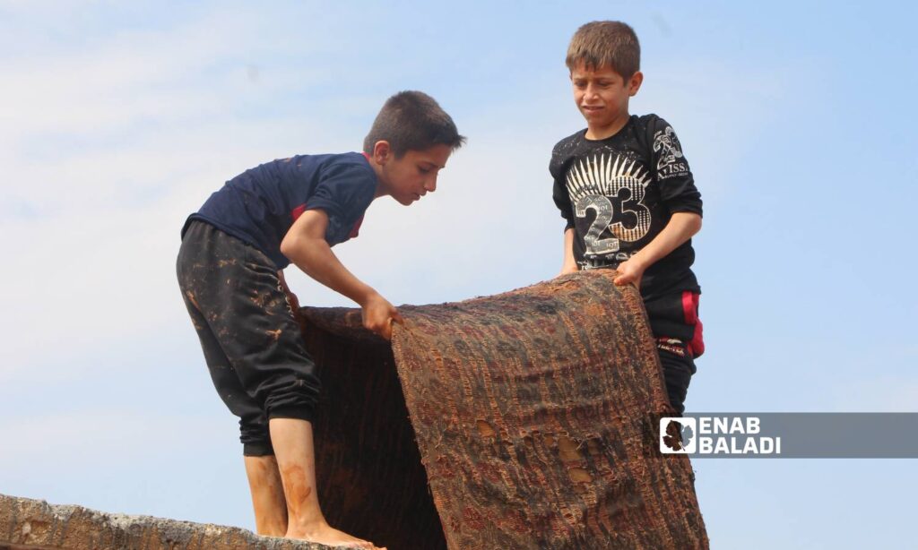 Rainwater leaked into the tents of displaced people at the Sham Maryam camp on the outskirts of Maarat Misrin city due to a rainstorm - May 2, 2024 (Enab Baladi/Iyad Abdul Jawad)